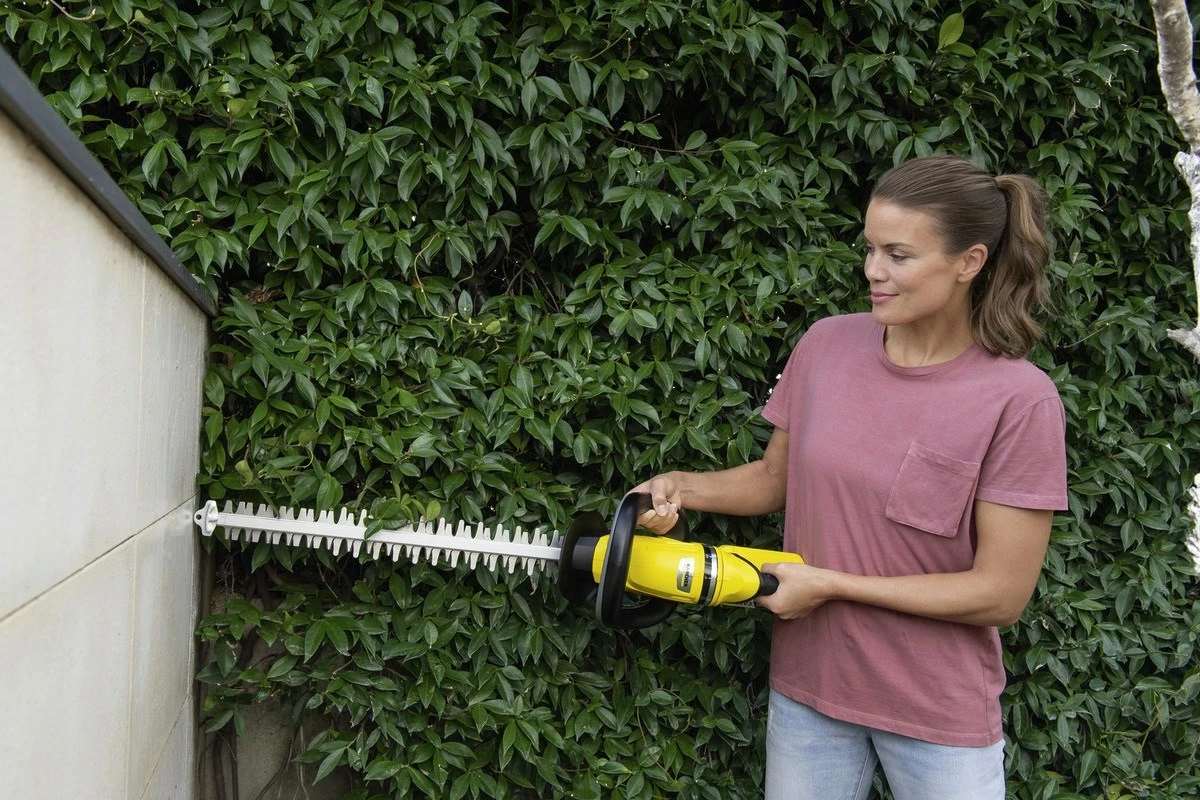 Brezžični obrezovalec KARCHER HGE 18-50 Battery Set, 18 V, 2,5 Ah, rumeno/črn