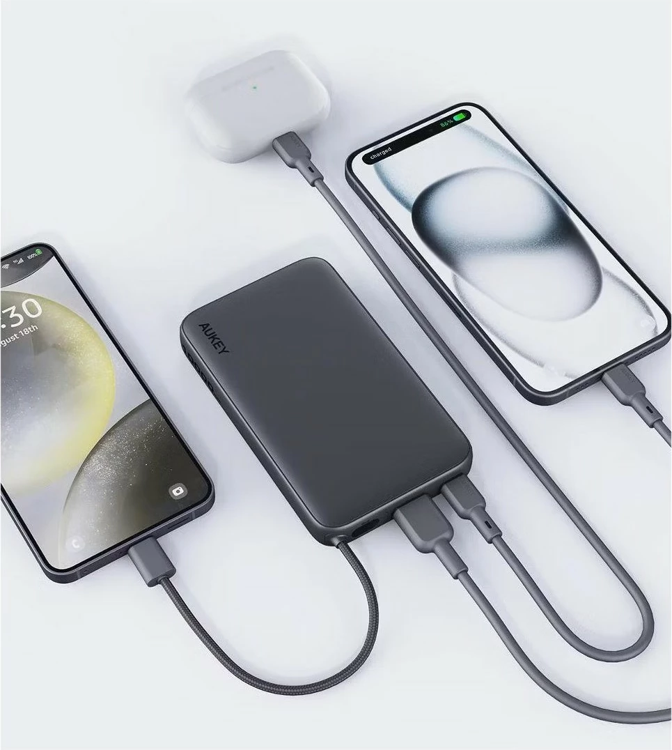 Power bank 10000 mAh, 22.5W, 4×USB, z vgrajenim kablom USB-C, AUKEY Spark Sling PB-Y53P, črn Power bank 10000 mAh, 22.5W, 4×USB, z vgrajenim kablom USB-C, AUKEY Spark Sling PB-Y53P, črn
